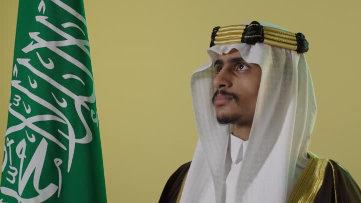 Saudi Man with Flag Founding Day Studio Portrait