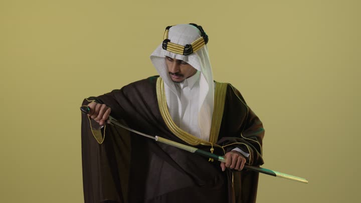 Saudi Man in Traditional Bisht Holding Sword Portrait