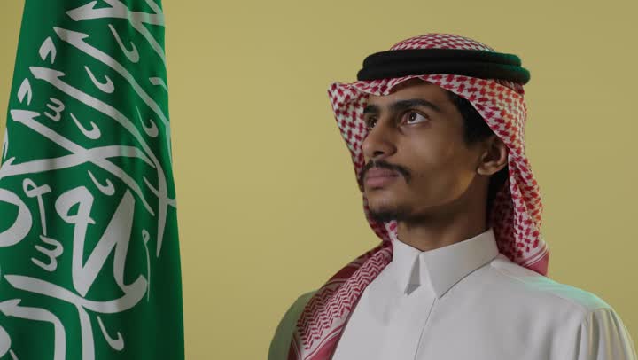 Saudi Man with National Flag on Founding Day Portrait