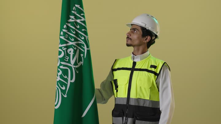 Saudi Engineer with National Flag for Founding Day