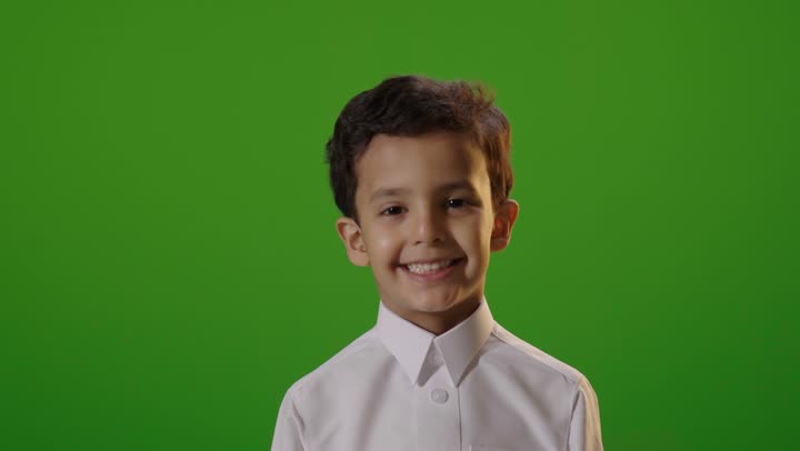 Saudi Boy in White Thobe Smiling on Green Screen