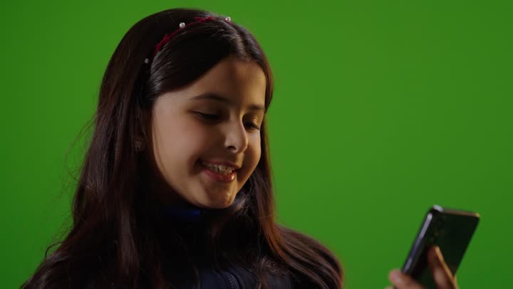 Girl Using Smartphone on Green Screen Chroma Key
