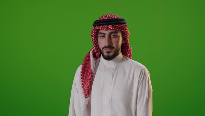 Saudi Man in Traditional Thobe Smiling Green Screen