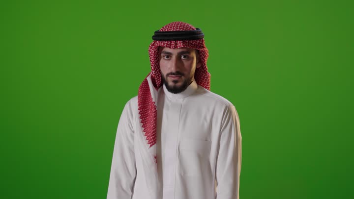 Saudi Man Gesturing Thumbs Down on Green Screen