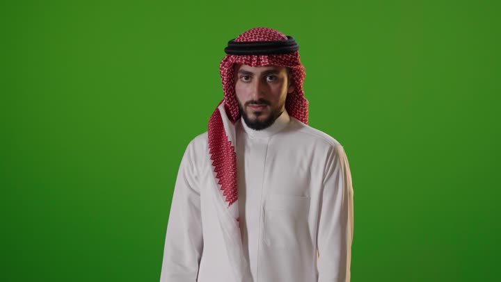 Arab Man Making Stop Gesture on Green Screen Background