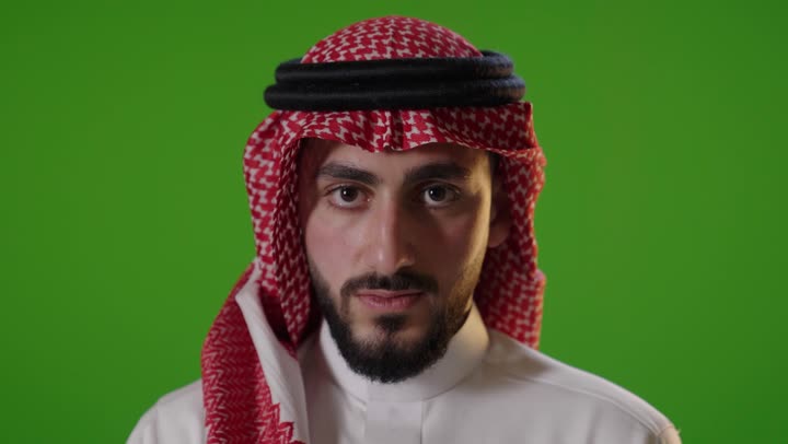 Saudi Man Making Stop Gesture on Green Screen Background