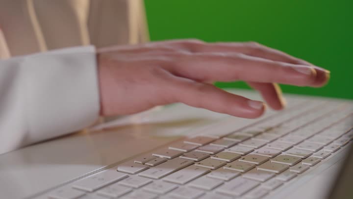 Hand Typing on Laptop Keyboard Green Screen Close-up