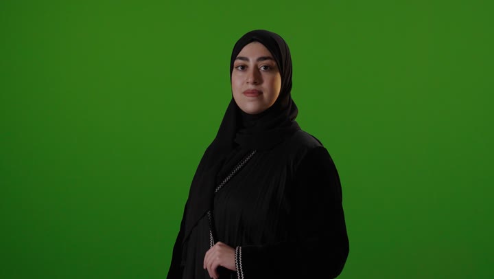Saudi Woman in Abaya Smiling on Green Screen