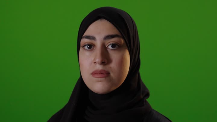 Muslim Woman Thumbs Down Green Screen Gesture