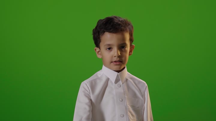 Saudi Boy in Thobe Making Stop Gesture Green Screen