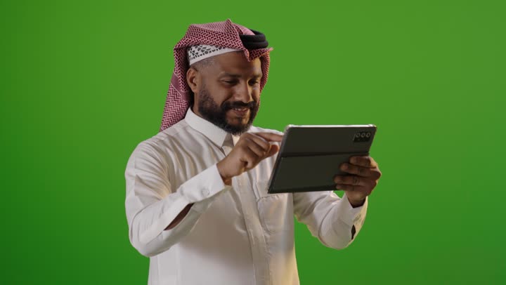 Arab Man Using Tablet on Green Screen Chroma Key