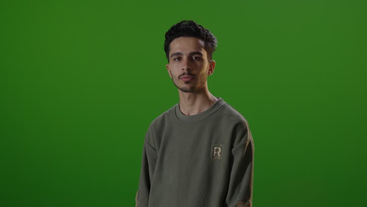 Man on Green Screen Crossing Arms Static Shot