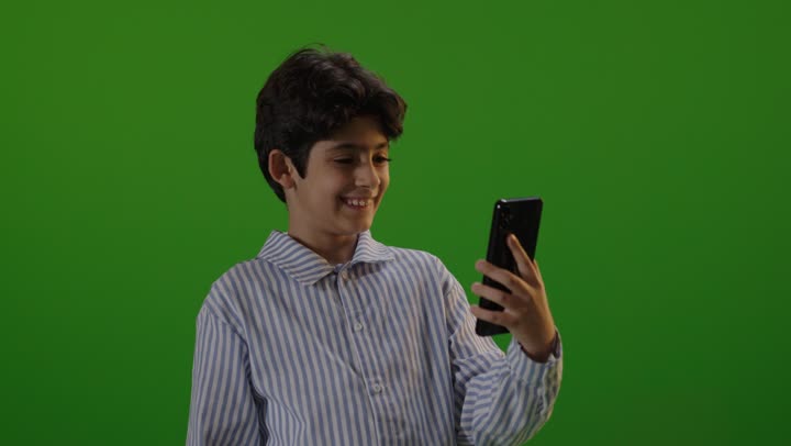 Arab Boy Using Smartphone on Green Screen