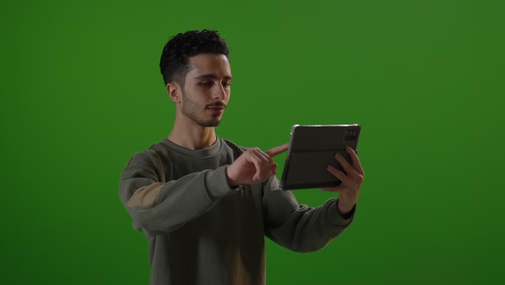 Man Using Digital Tablet on Green Screen