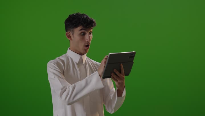 Saudi Man Using Digital Tablet on Green Screen