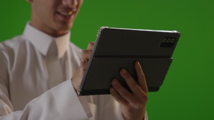 Saudi Businessman Using Digital Tablet on Green Screen