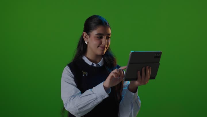 Saudi Woman Using Digital Tablet on Green Screen
