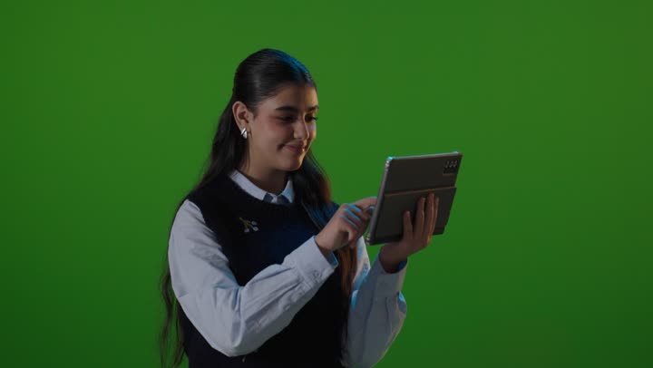 Arab Woman Using Digital Tablet on Green Screen Studio Footage