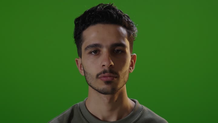 Man Giving Thumbs Down Gesture on Green Screen