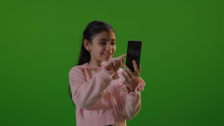 Middle Eastern Girl Using Smartphone on Green Screen