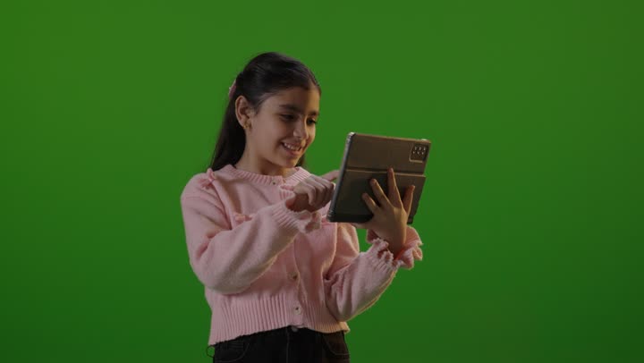 Arab Girl Using Tablet on Green Screen Background