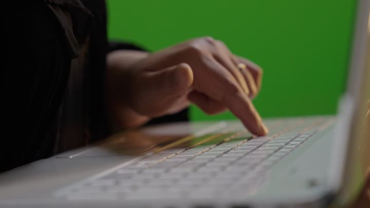 Person Typing on Laptop Green Screen Chroma Key