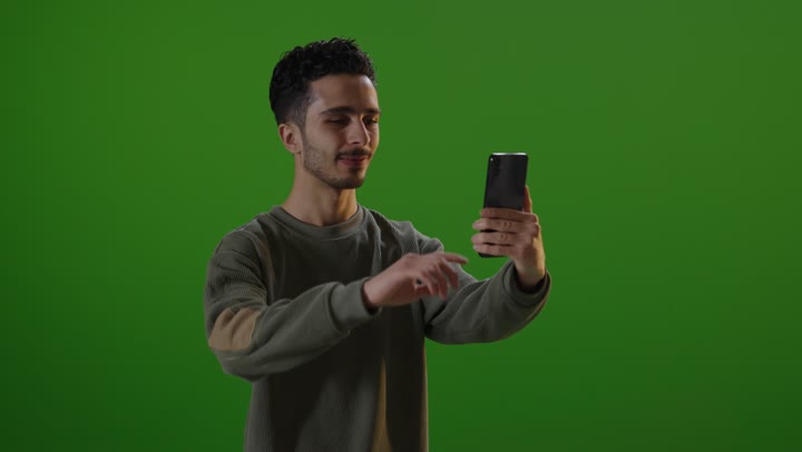 Man Using Smartphone on Green Screen Chroma Key