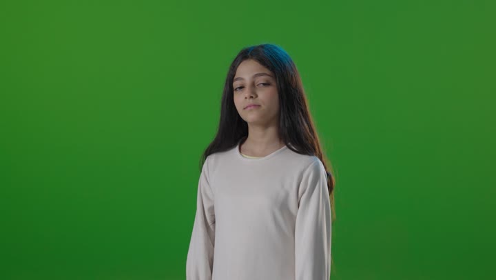 Saudi Girl Arms Crossed Green Screen Portrait