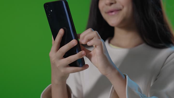 Saudi Girl Using Smartphone on Green Screen Chroma Key
