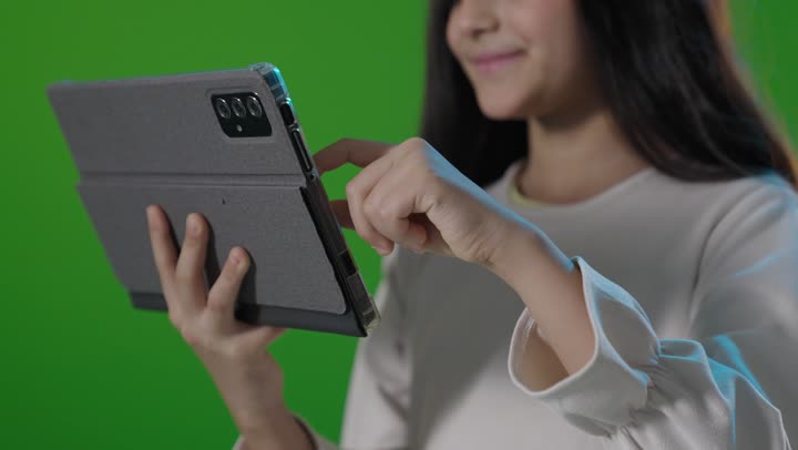 Saudi Girl Using Tablet on Green Screen Chroma Key