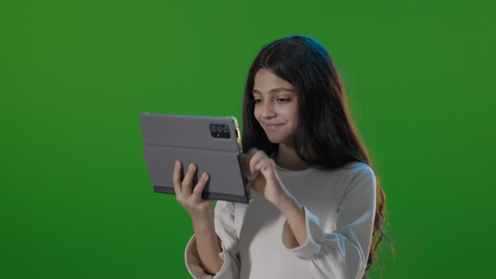 Saudi Girl Using Tablet on Green Screen Chroma Key