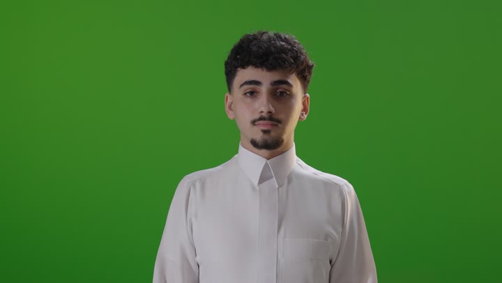 Saudi Man in White Thobe Smiling on Green Screen