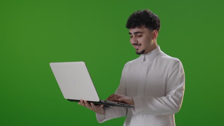 Saudi Man Using Laptop on Green Screen