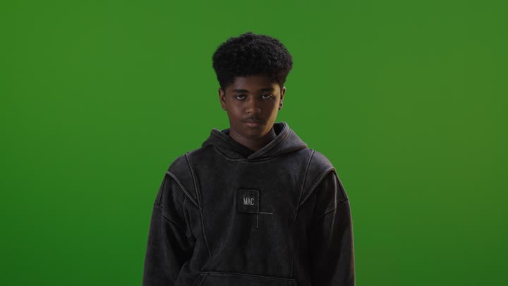 Saudi Teenage Boy Thinking on Green Screen Chroma Key