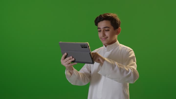 Saudi Boy Using Tablet Green Screen Footage