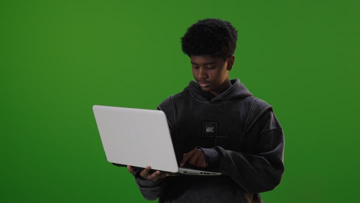 Saudi Boy Laptop Green Screen Typing Footage