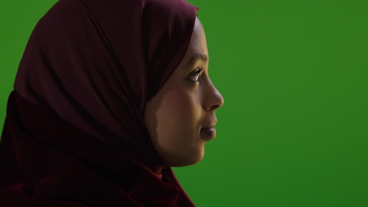 Saudi Woman in Hijab Turning on Green Screen Background