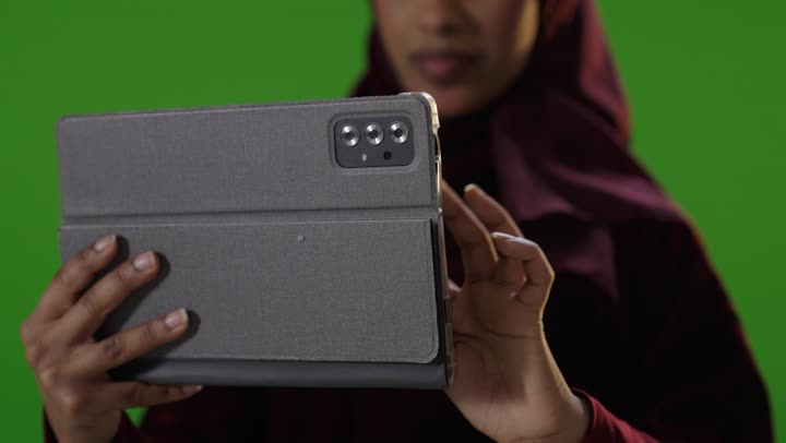 Saudi Woman Using Tablet on Green Screen Chroma Key