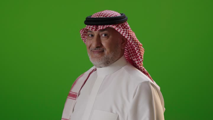 Saudi Man in Traditional Dress on Green Screen Portrait