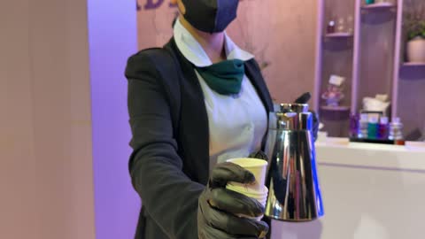 Hospitality Worker Serving Coffee at Dhahran Event