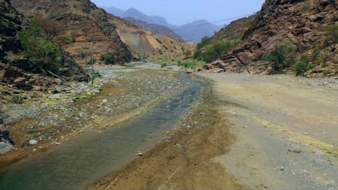 Rocky Mountain Wadi Stream and Landscape Aerial Footage