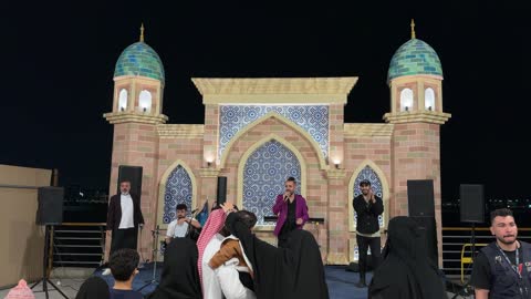 Live Band Performing on Islamic Stage at Night