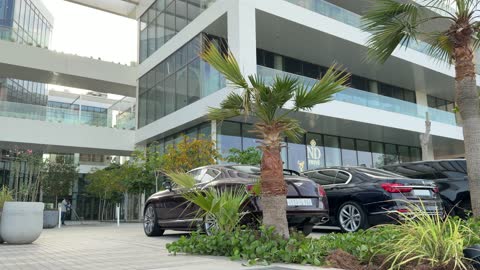 Luxury Cars Parked at Modern Building Saudi Arabia