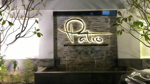 Patio Sign and Water Fountain Night Footage