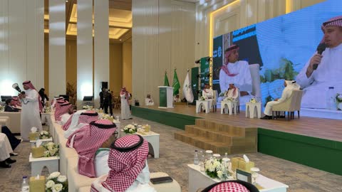 Saudi Men Attend Conference Panel Discussion Indoor