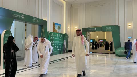 Saudi Men Walking at Health Investment Forum Event