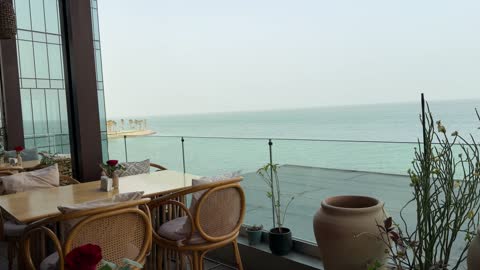 Seaside Restaurant Terrace Overlooking Calm Ocean Water