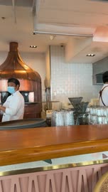Barista Waving Behind Coffee Shop Counter Video