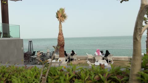 Saudi People at Beachfront Cafe Coastal Footage