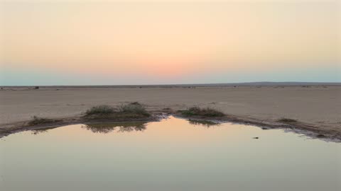 Desert Pond Sunset Reflection Aerial Drone Footage